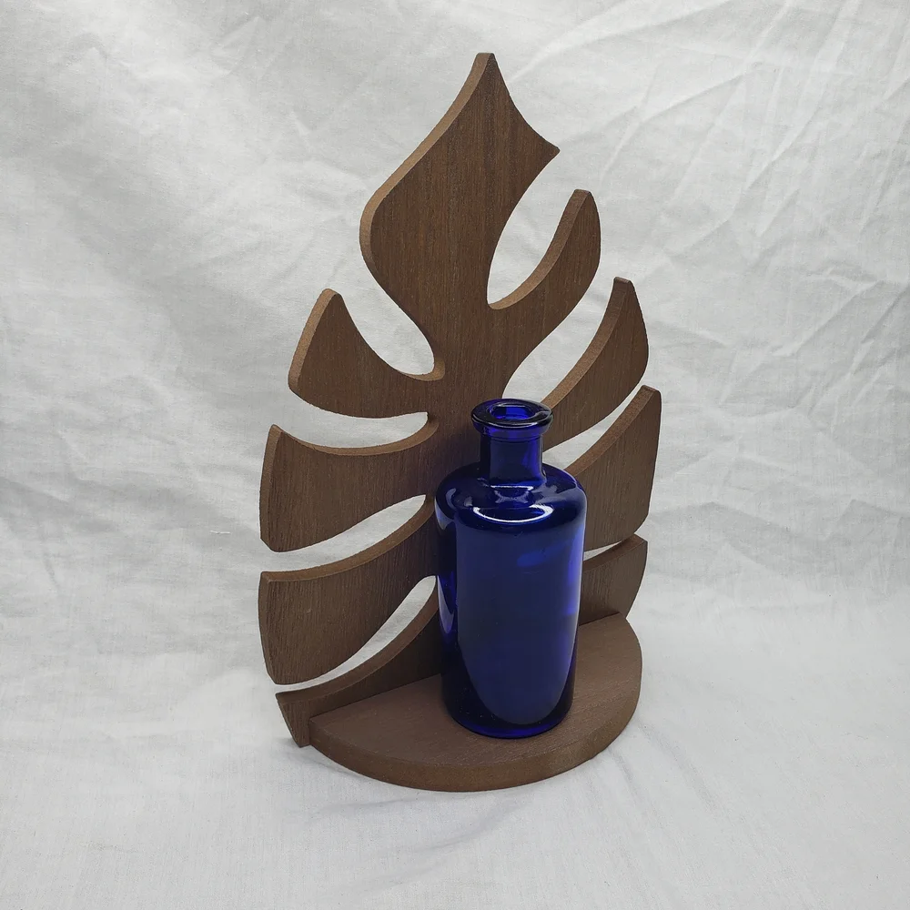 Wood Monstera Leaf Shelf With Blue Glass Vase